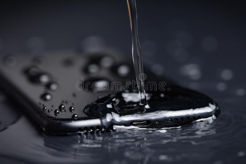 close up water drop phone device waterproof concept closeup 94669210